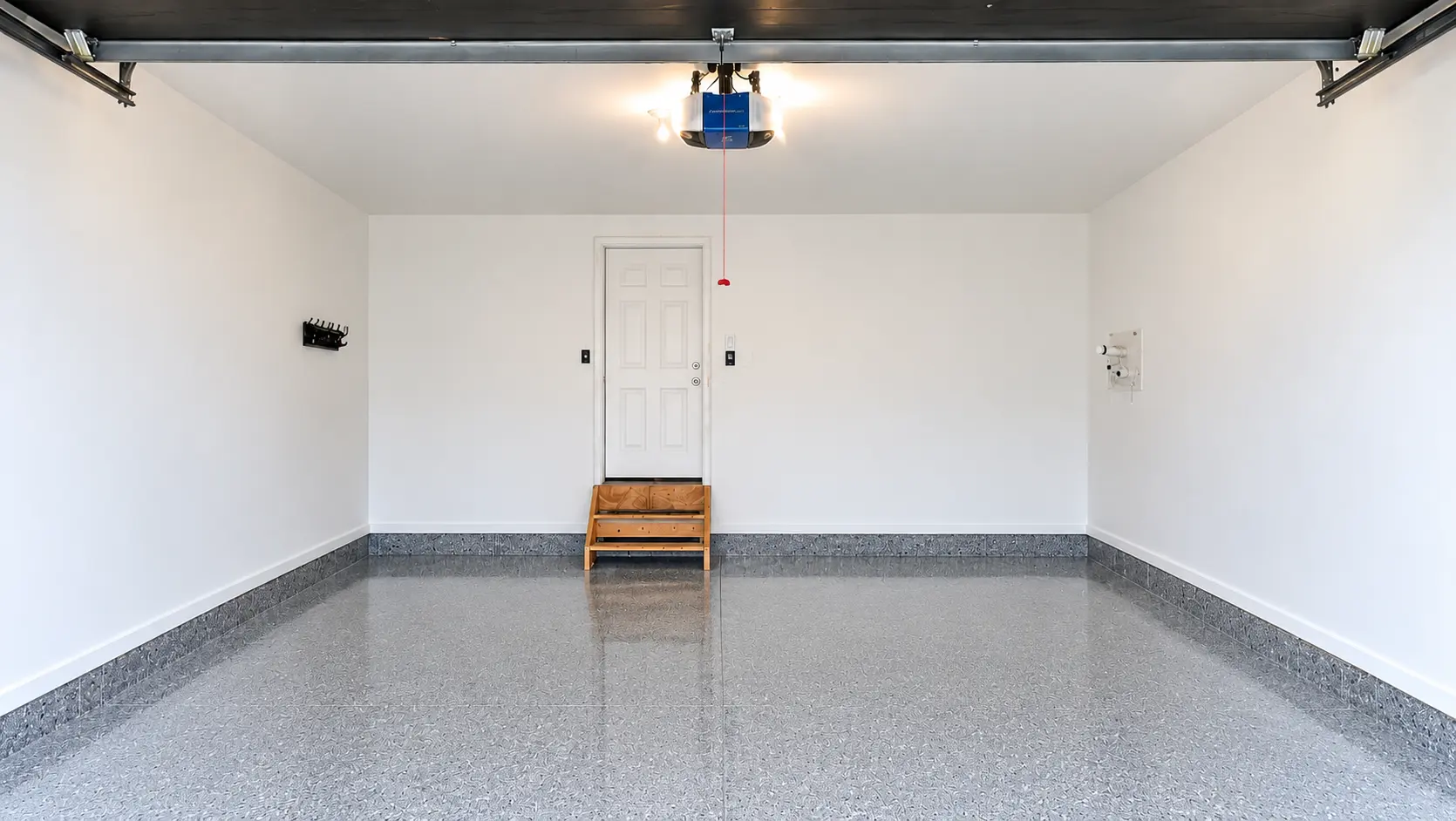 Premium Finish garage with finished white walls, ceiling and grey EpoxyShield floor coating